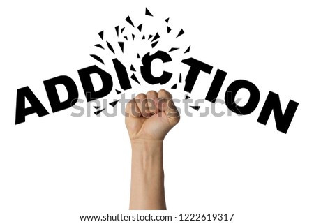Male hand clenched into a fist breaks text addiction on a white background. Concept of the fight against addiction, drugs, medical priporaty, alcoholism, gambling
