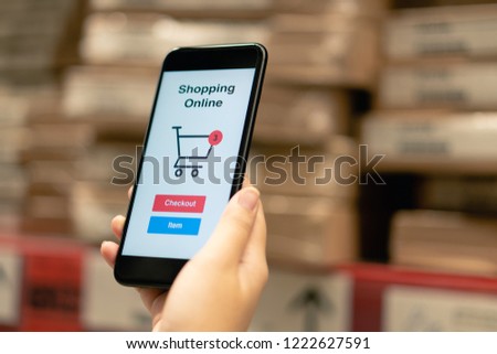 Online shopping with smartphone and shopping bags delivery service using as background shopping concept and delivery service concept with copy space  for your text or  design.