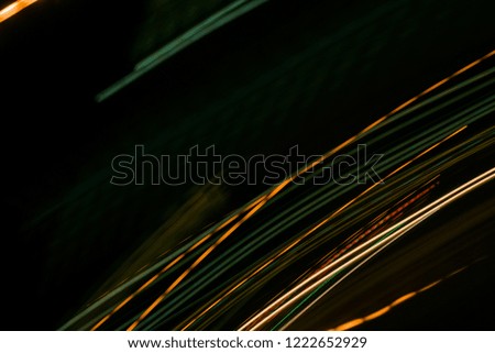 Colorful lights of urban surrounding blurred by motion