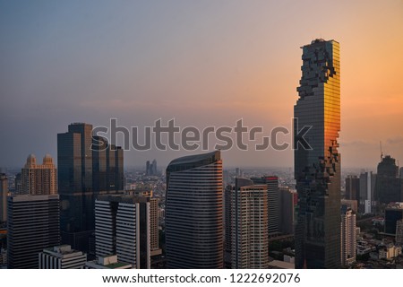 scenic of cityscape with sunset skyline and light on building