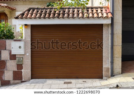 metal garage door in a stone wall