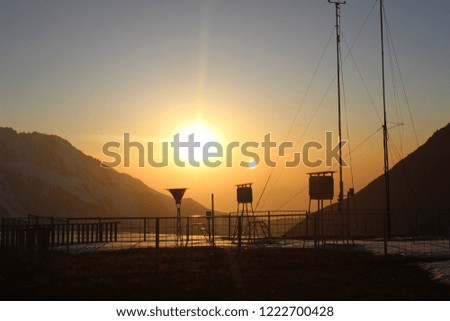 Golden sunset in the mountains at the Space Station Almaty