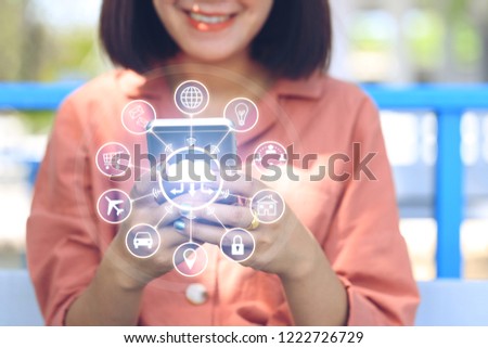 Internet of Things (IoT), Soft focus of Woman using smart phone and iot icon or hologram with in coffee shop, Communication network service and Business concept