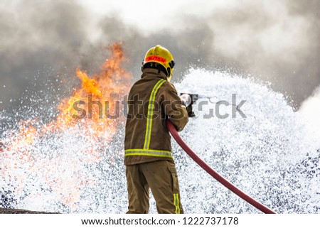 Air Base Firefighters Royalty-Free Stock Photo #1222737178