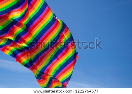 LGBT flag and sky in the background