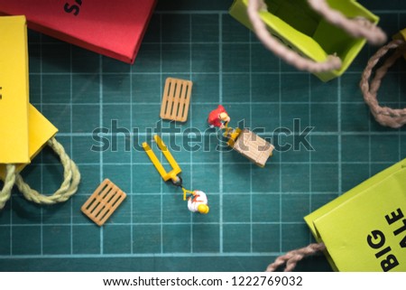 Sale concept. Miniature worker prepare for transport order from online shopping