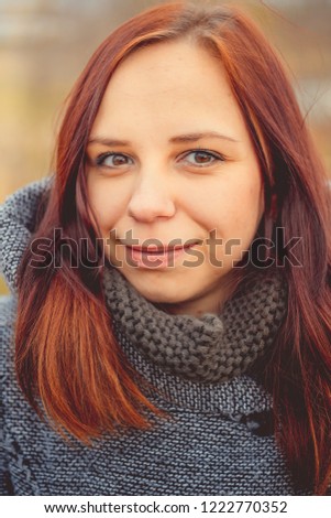 Girl on a background of yellow leaves of autumn trees. Autumn photo session. Autumn woman walking outdoors
