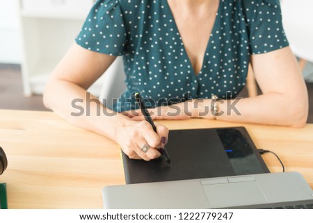 Office, graphic designer concept - Business woman hands holding digital tablet, drawing the sketch