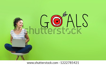 Goals with target with young woman using a laptop computer 