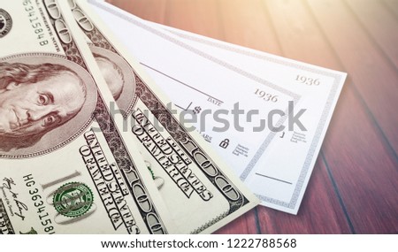 American dollar bill with check