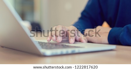 close up freelancer man hand touch on pad bar laptop for searching job or fill out personal data to application form in job website and work from home concept Royalty-Free Stock Photo #1222817620