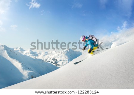 Female freeride skier Royalty-Free Stock Photo #122283124