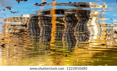 reflection in the water of a building under construction, abstraction, curvature