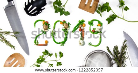 Number 2018 written with vegetables and kitchen utensils as advertising or presentation in food industry, menus, brochures. Isolated on white background. Happy new year. End of the year resolution Royalty-Free Stock Photo #1222852057