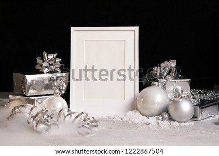 Mock up frame on dark background with Christmas decorations baubles, gift boxes and snow Invitation, card. Copy spase Trendy black ans white minimal concept