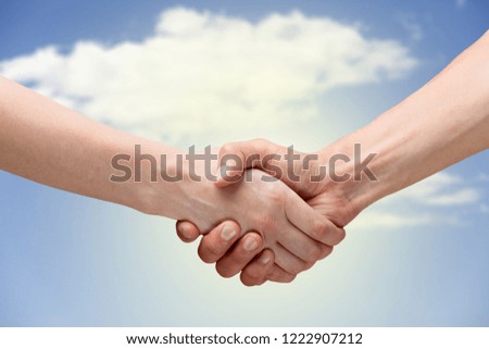 Business handshake of business people on background