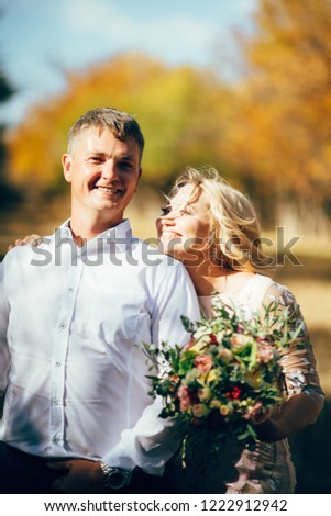 bride and groom fall in the forest