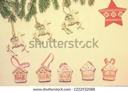 Beautiful white horses gallop across the sky to the star. They jump over a gingerbread small town from several cities.