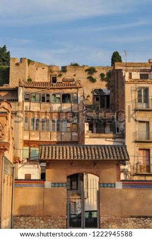 view of some old buildings with a stone wall in Tortosa, catalonia, mediterranea, spain, europe