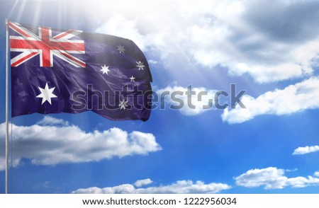 Flag of Australia on a flagpole against a blue sky, with a good place for your text.