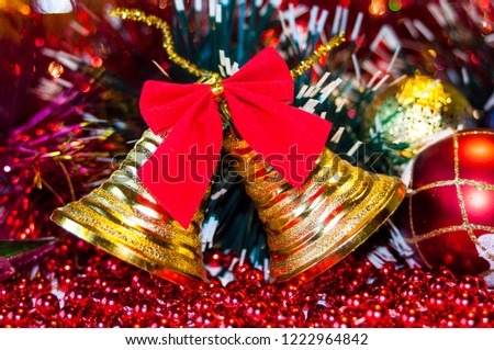 beautiful Christmas golden bells with a red bow, colorful Christmas decorations for Christmas, close-up