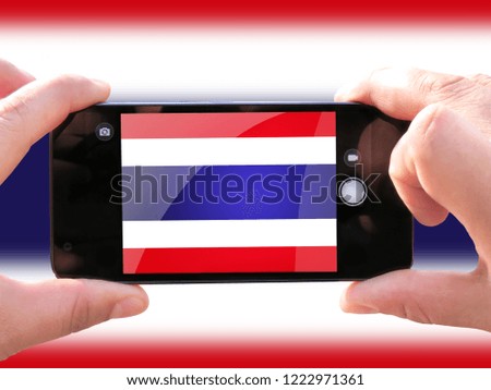 The concept of tourism and travel. The hands of men make a telephone photograph of the flag of Costa Rica. On the smartphone close-up image of the flag. Photos for social networks, blogs, instagram.