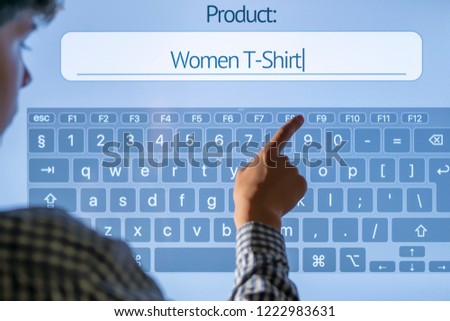 hand searching for product in the store using touch screen panel