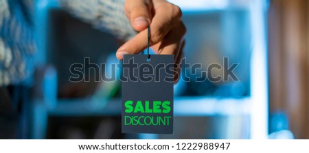 banner of hand holding a price tage with sale concept sales discount text