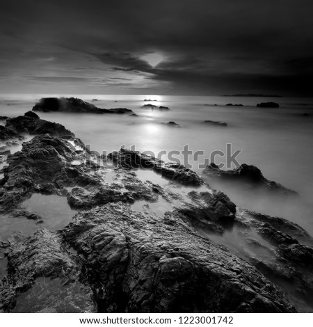 Long exposure seascape. rocky beach  in black and white. Nature composition.