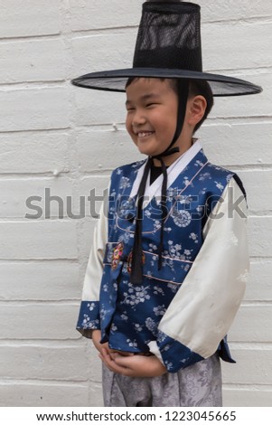 Portrait of a Happy Asian Chinese kid with Korean traditional costume at Seoul Korea.

