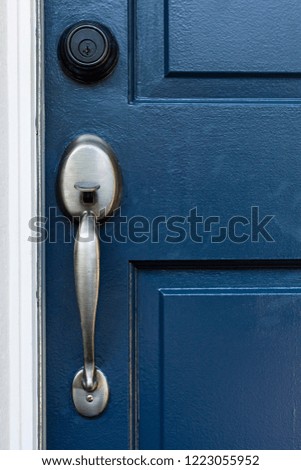 Classic door handle on blue door