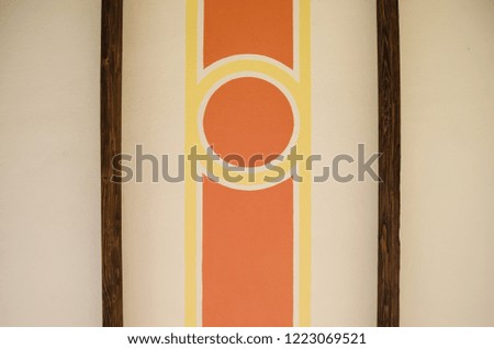 abstract geometrical figures of the interior painting of an old house, red circle with yellow lines and wooden bars,abstract interior background.