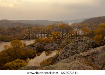 panorama of autumn river under a cloudy blue sky bright yellow trees