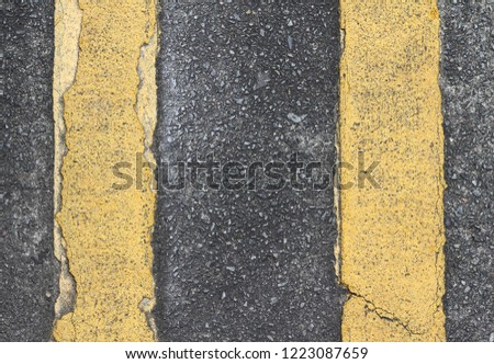 Asphalt background with yellow stripe