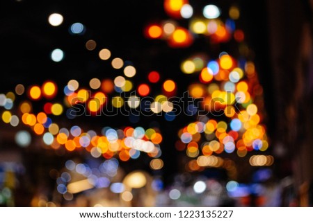 Abstract bokeh light from bulb in the city at midnight