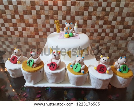 Armisn birthday celebrate pure white smooth creamy cake  decorated with pandas and cup cakes