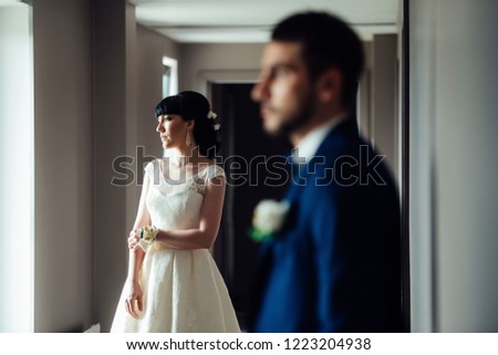 Bride and groom in the hallway