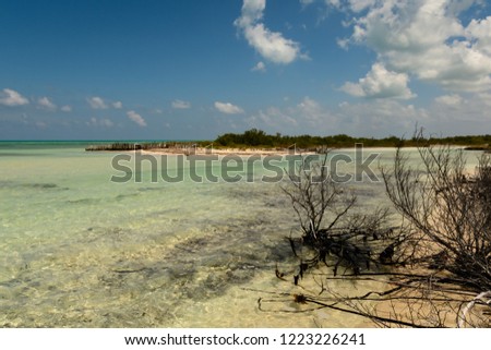 Caribbean sea in Mexico with shallow water and clouds