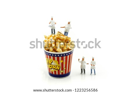 Miniature people : Chef and friend with popcorn.