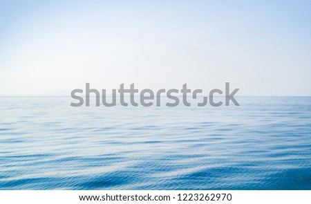 Idyllic view of the ocean and sky. Blue sea background.