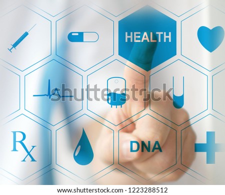Medical doctor pressing virtual button on modern medical touchscreen by his finger. Concept of modern healthcare and innovition in medicine