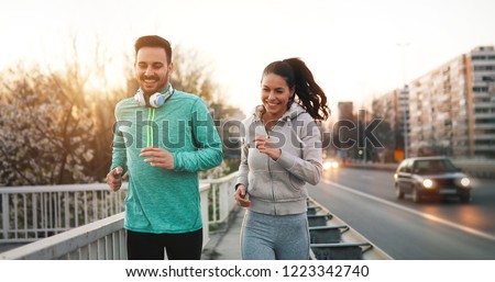 Friends fitness training together outdoors living active healthy Royalty-Free Stock Photo #1223342740