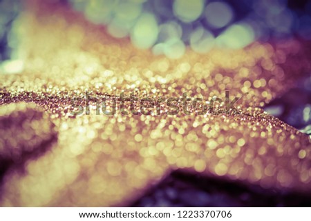 abstract Christmas background with holiday lights and copy space - magic bokeh glitter with blinking stars and falling snowflakes