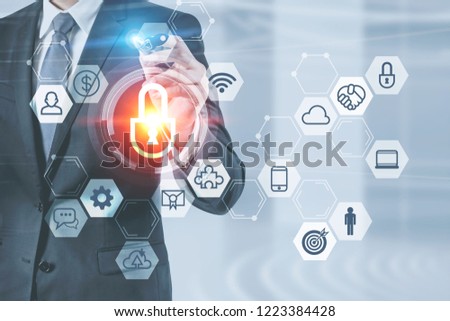 Unrecognizable businessman in dark suit and gray tie using secure computer technology interface for business standing in his office. Toned image double exposure
