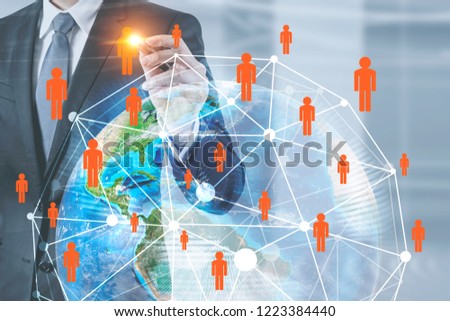 Unrecognizable businessman working with global business network hologram in his office. Toned image double exposure Elements of this image furnished by NASA