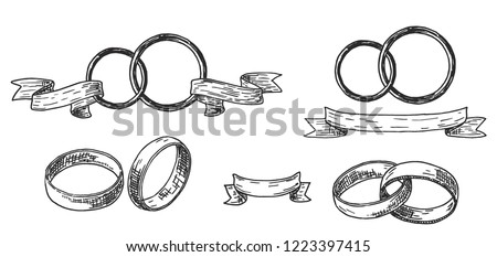 Wedding rings set. Wedding rings or bands in a vintage retro engraved etching woodcut style Royalty-Free Stock Photo #1223397415