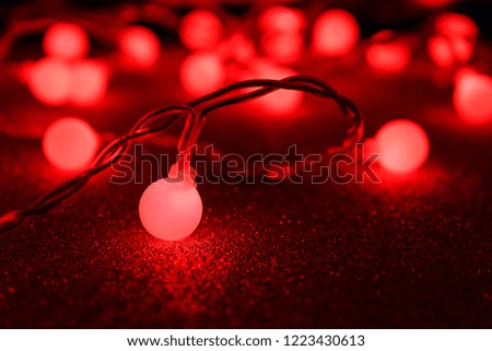 Glowing Christmas lights on dark background