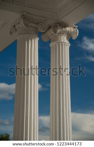 Columns on blue sky background. architectural background.