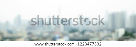 Blurred background of cityscape concept: Abstract blur aerial view city in day light. banner