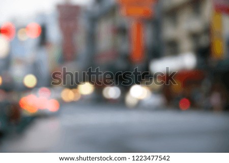 City lights abstract circular bokeh with blue color sunset, blurry building and street nightlife, abstract background